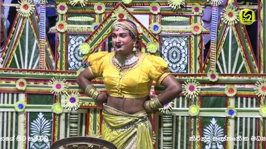 A performer on stage at the Kirinda Cultural Center